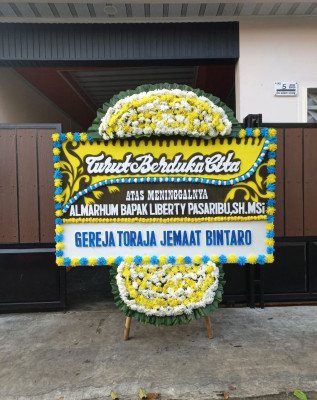 Papan Bunga Duka di Dogomo